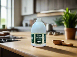 Gallon bottle of cleaning solution on a desk in an office setting